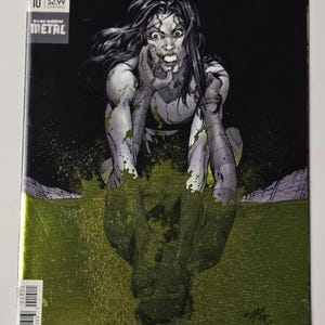 May include: The Silencer issue 10 comic book from DC Universe The New Age of Heroes. The cover features a black and white illustration of a woman with long dark hair, hands near her face, emerging from a vibrant green liquid against a black background.