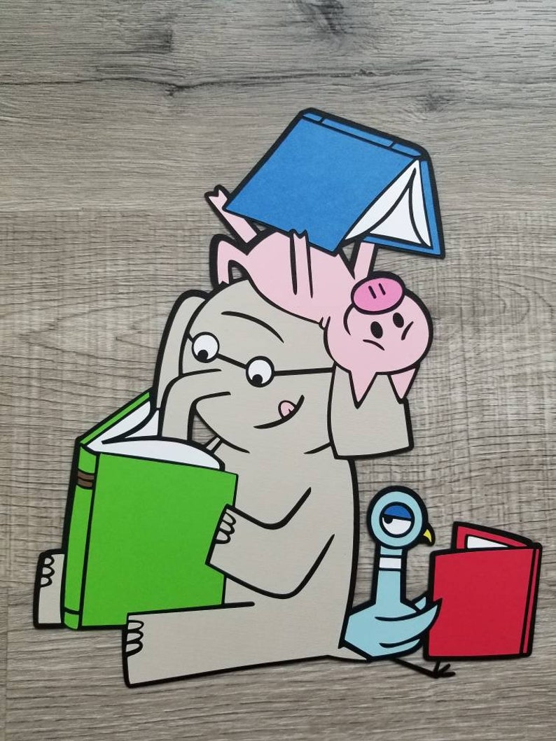 May include: A layered paper cutout illustration featuring a gray elephant wearing glasses and reading a green book. A pink pig balances a blue book on its back while resting on the elephant's head. A blue pigeon sits nearby reading a red book.