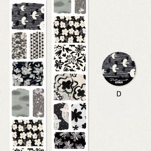 May include: A selection of decorative stickers and washi tape rolls featuring diverse black and white floral and abstract designs. A round sticker with the text "Palimpsest" and the letter "D" is also included.