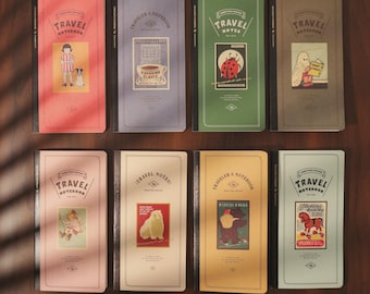 May include: Eight notebooks with colorful covers are displayed. Each notebook features the words "TRAVEL NOTEBOOK" and a unique vintage-style illustration. The covers are in shades of red, blue, green, brown, pink, cream, yellow, and light blue.