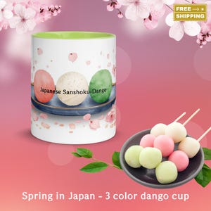 May include: A white ceramic mug with a green interior, featuring a Japanese Sanshoku-Dango design. The mug showcases three colorful dango, with the text "Japanese Sanshoku-Dango". A plate of dango is also present. The text "Spring in Japan - 3 color dango cup" is at the bottom.