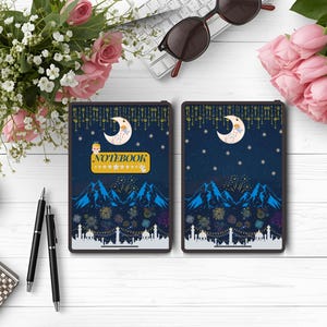 May include: Two notebooks with a dark blue cover featuring a crescent moon, stars, and mountain design. The word "NOTEBOOK" is displayed on a yellow banner. The notebooks are surrounded by flowers, pens, and sunglasses.