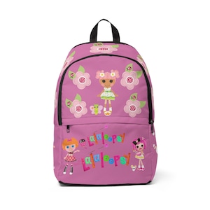 May include: A pink backpack featuring a repeating pattern of light pink flowers, green leaves, and ladybugs. The front displays a central doll character, two additional doll characters at the bottom, and the colorful text Lalaloopsy printed twice.