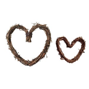 May include: Two brown twig heart wreaths, one larger than the other, on a white background.