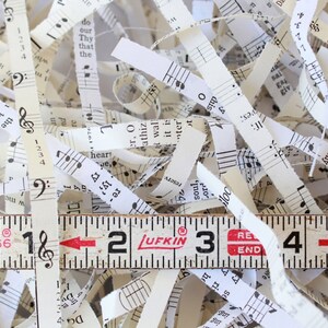 Shredded paper made from old hymnals. The paper is a mix of ivory and cream colors.