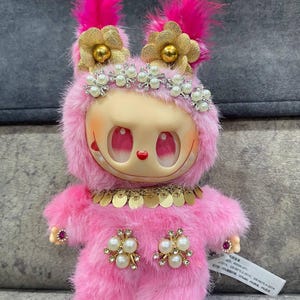 Whimsical Pink Plush Art Doll – Handmade Fantasy Creature with Feathers, Pearls & Golden Floral Details – Collectible Gift for Doll Lovers