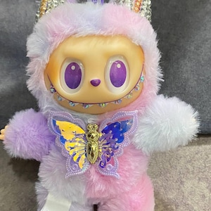 Magical Pastel Plush Art Doll – Fantasy Creature with Purple Eyes & Iridescent Butterfly Charm – Unique Collectible Gift