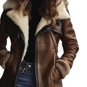 May include: A brown leather jacket with a cream-colored shearling lining on the collar and cuffs. The jacket has a zipper closure and two front pockets. The jacket is worn over a black turtleneck and blue jeans.