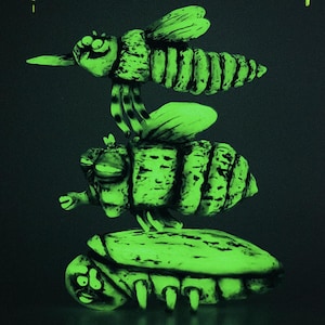 May include: A glow-in-the-dark sculpture featuring three stacked insects. The top insect is a bee with wings, the middle is a larger bee, and the bottom is a beetle-like insect. All figures have a bright neon green luminescence with black details.
