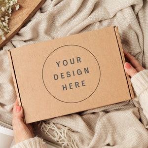 Gift box packaging mockup with hands. Kraft brown postage box mockup.