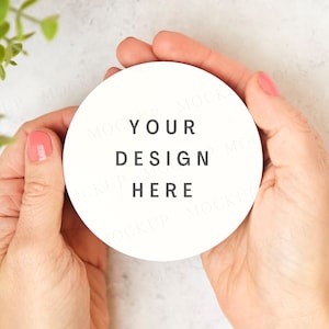 May include: A white round sticker with the text "YOUR DESIGN HERE" in black lettering.