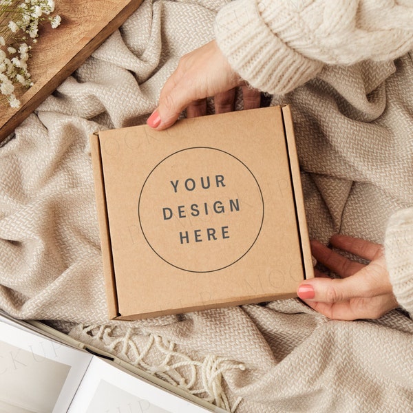 Gift box packaging mockup with hands. Kraft brown postage box mockup.