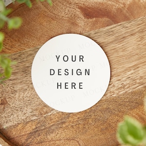Coaster mockup, round white drink coasters. Styled flat lay circular coaster mock up on wood surface. Wedding bridal gift mock-up.