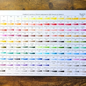 May include: A printed swatch sheet for Faber-Castell Polychromos 120 colored pencils. The sheet displays a grid of color swatches, each labeled with a color name and number, including shades of red, blue, green, and yellow.