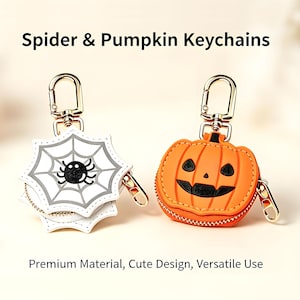 May include: Two keychains with gold-tone lobster clasps and zippers. One is a white spiderweb shape with a black spider, the other is an orange pumpkin with a black jack-o'-lantern face. Text reads: Spider & Pumpkin Keychains, Premium Material, Cute Design, Versatile Use.