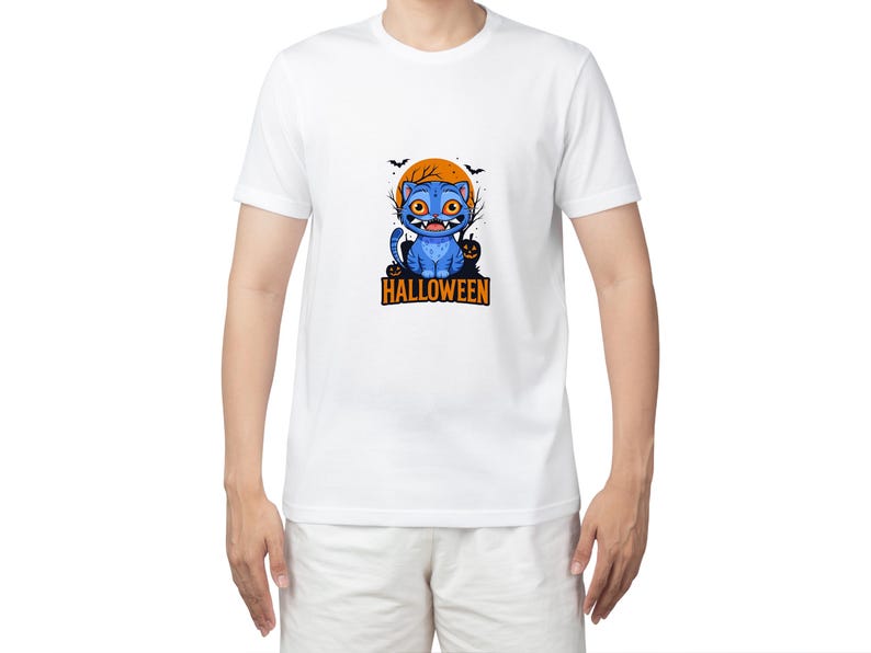 May include: White t-shirt with a blue cartoon cat design. The cat has orange eyes, fangs, and a pumpkin. The design includes an orange moon and bats, with the word "HALLOWEEN" printed below in orange.