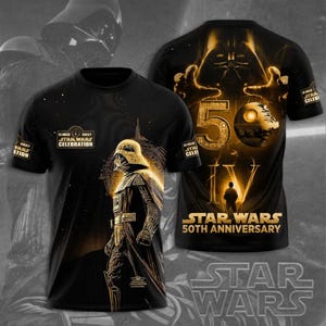 Op de afbeelding: Zwart t-shirt met een gouden illustratie van Darth Vader en de tekst "STAR WARS CELEBRATION 2027". De achterkant van het shirt toont het nummer "50" en de tekst "STAR WARS 50TH ANNIVERSARY".