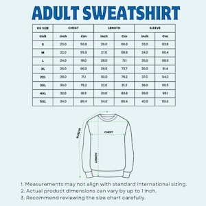 May include: A size chart for adult sweatshirts, with measurements in inches and centimeters. The chart includes chest, length, and sleeve dimensions for sizes S through 5XL. The text "ADULT SWEATSHIRT" is at the top.
