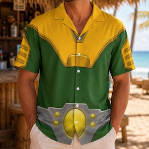 May include: A short-sleeve button-down shirt featuring a graphic print that mimics a suit of armor. The design includes a yellow chest plate, green fabric, and a grey belt detail with yellow circular accents across the waist area.