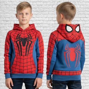 May include: Red and blue Spider-Man hoodie with a large black spider graphic on the front and a red spider on the back. The hoodie has a hood with white eye shapes and a front pocket. The sleeves and sides are blue.