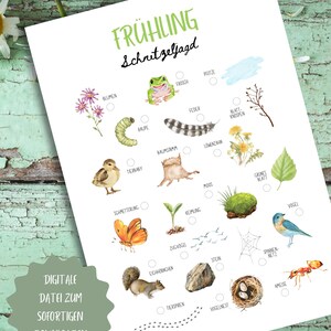 May include: A white paper with the words "FR&Uuml;HLING Schnitzeljagd" in green, featuring watercolor illustrations of flowers, a frog, a caterpillar, a feather, a butterfly, a squirrel, and other nature elements. The text "DIGITALE DATEI ZUM SOFORTIGEN DOWNLOADEN" is also present.