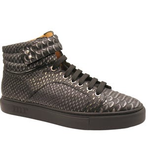 May include: High-top sneaker in a dark gray, textured pattern. The shoe features black laces, a black sole, and a padded collar with silver-tone hardware. The brand name "mr" is embossed on the sole.