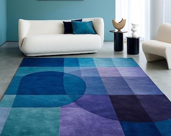 Handgetuft tapijt van Nieuw-Zeelandse wol, geometrisch blauwpaars ontwerp