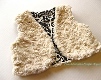 Girls' reversible faux fur vest. Black and ivory damask and creamy fur.