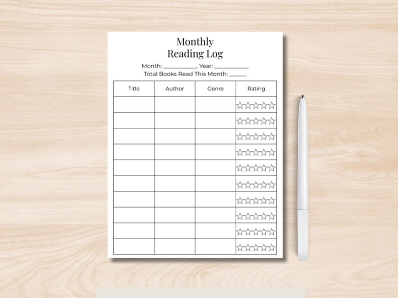 Printable monthly reading log displayed on wooden desk with pen, minimalist book tracking sheet with star rating column and editable month field.