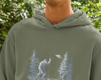 Bigfoot Waving at UFO Hoodie: Pine Forest Graphic Sweatshirt