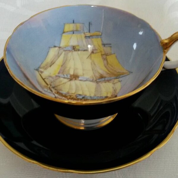 Aynsley Tea Cup and Saucer; Cobalt Blue; Featuring A Clipper Ship; Hand Painted And Signed By D Jones  circa 1930's-  DR