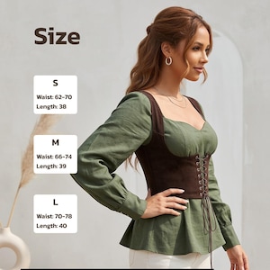 May include: A long-sleeved olive green blouse featuring a dark brown corset-style bodice with front lace-up detailing. The image includes a size chart with measurements in inches: S (Waist 62-70, Length 38), M (Waist 66-74, Length 39), and L (Waist 70-78, Length 40).