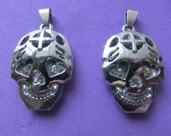 Skull Pendants/ Charms.  Two pieces.  Skulls with jeweled eyes and nose ready for jewelry making. Price is for both.