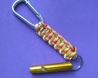Whistle Keychain. Yellow & orange mix paracord keychain with 2.25" aluminum whistle, carabiner clip. Loud whistle for fun and safety.