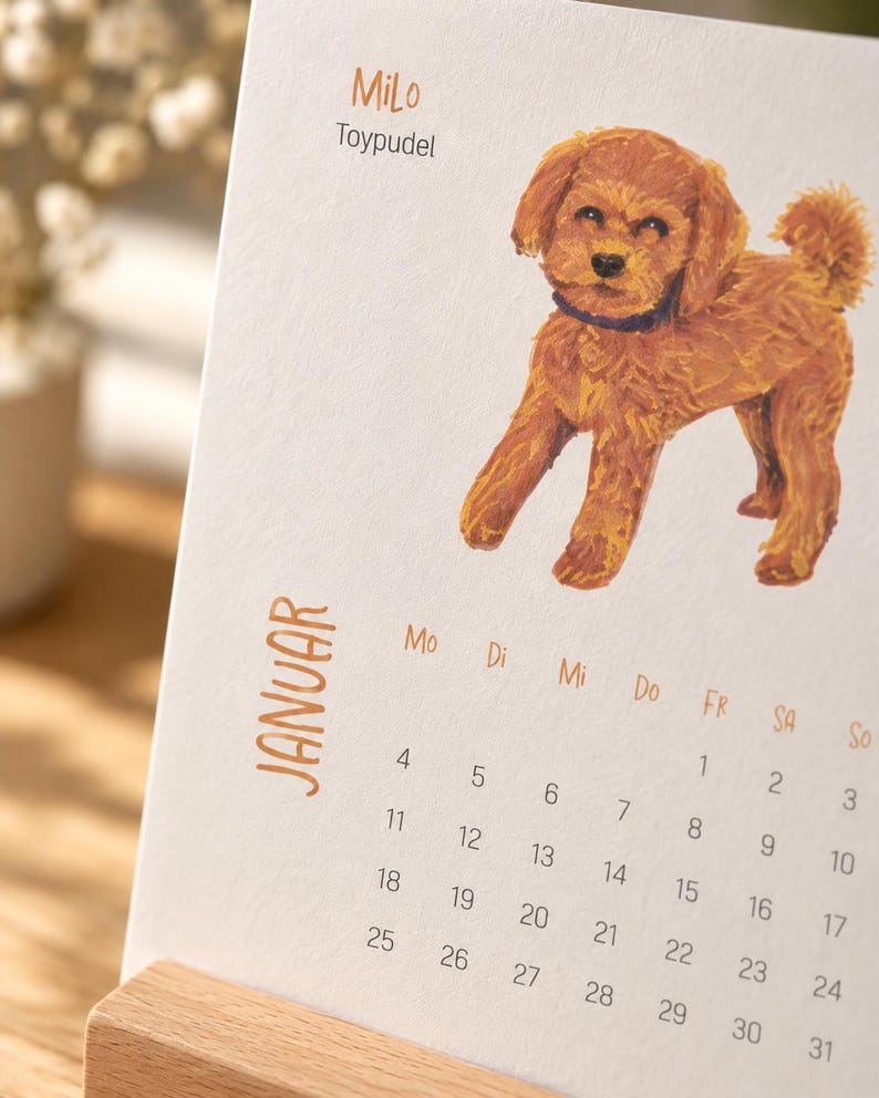 May include: A desk calendar page for January featuring a brown toy poodle illustration, the name Milo, and the text Toypudel. The calendar grid displays days of the week abbreviated as Mo, Di, Mi, Do, Fr, Sa, So, with dates from 1 to 31 printed in black.