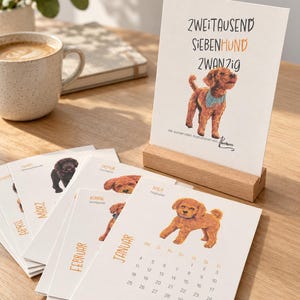 May include: A desk calendar featuring illustrations of poodles on white cardstock pages. The cover displays the text "ZWEITAUSEND SIEBENHUND ZWANZIG" with a brown poodle illustration. The pages are held upright by a rectangular wooden stand.
