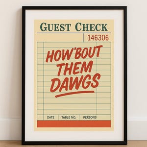 May include: Framed print with a vintage guest check design. The top reads "GUEST CHECK" and "146306." Bold red text in the centre says "HOW 'BOUT THEM DAWGS." The bottom has fields for date, table number, and persons.