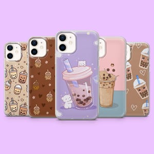 May include: Five phone cases with colorful designs. The cases feature illustrations of bubble tea drinks and related graphics. The cases are in shades of brown, pink, and purple, with white and blue accents. The cases are arranged in a row.