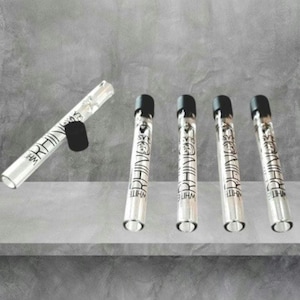 May include: A set of three ceramic mugs with a speckled, matte finish. Each mug features a different color: light blue, cream, and gray. The mugs have a simple, modern design and a comfortable handle.