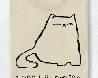 May include: A beige crew neck t-shirt featuring a black line drawing of a grumpy-looking cat with narrow eyes. Below the cat illustration, the text "I need ibuprofen" is printed in a simple, dark, hand-drawn style font on the front of the shirt.