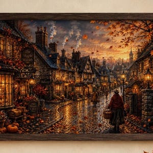 May include: A framed wall art print depicting a cobblestone street in an autumn village at sunset. The scene features timber-framed buildings, glowing windows, falling orange leaves, and a person carrying a basket. Signs read The Maple Wreath, Bakery, and Old Leaf Lane.