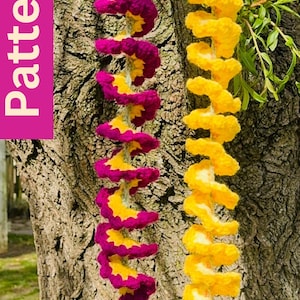 May include: Two decorative spiral garlands, one magenta and yellow, the other yellow, hanging against a tree trunk. The magenta garland has a tassel. The word "Pattern" is in a pink box on the left.