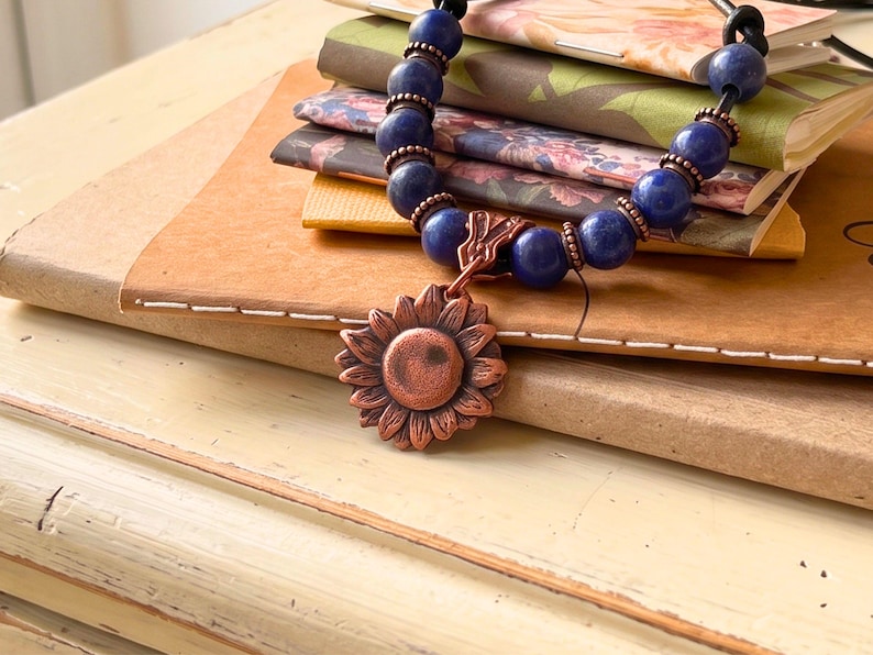 Copper Sunflower Necklace Handmade Artisan Crafted Pendant Genuine Metal Flower Charm Leather Cord Adjustable Length Boho Statement Piece Birthday Gift Teen Women Jewelry Nature Inspired Design Vintage Rustic Style Everyday Wear Bohemian