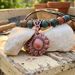 Nature Inspired Jewelry Copper Sunflower Necklace Handmade Pendant Vintage Bohemian Style Statement Piece Artisan Crafted Charm Leather Cord Adjustable Length Birthday Gift Teen Women Genuine Metal Flower Boho Accessory Rustic Design