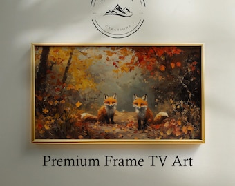 May include: A framed artwork depicting two foxes in an autumnal forest. The painting uses warm colours of orange, yellow, and brown, with the text "Premium Frame TV Art" at the bottom. The artwork is framed in a gold-coloured frame.