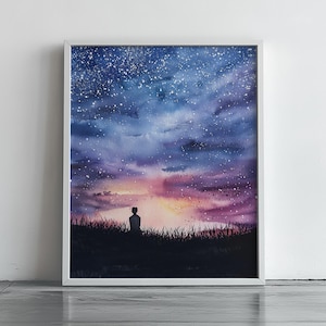 May include: Watercolor painting of a starry night sky with a person silhouetted in the foreground. The artwork features a gradient of blues, purples, and pinks, with a white frame. The person is sitting in tall grass.