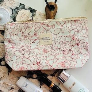 Pochette florale à fermeture éclair faite main : trousse de maquillage et de cosmétiques de voyage