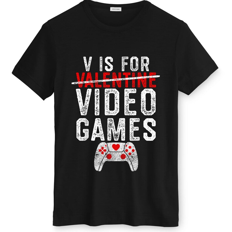 May include: Black t-shirt with white distressed text that reads "V IS FOR VIDEO GAMES." The word "VALENTINE" is crossed out in red. A white controller graphic with red hearts is at the bottom.