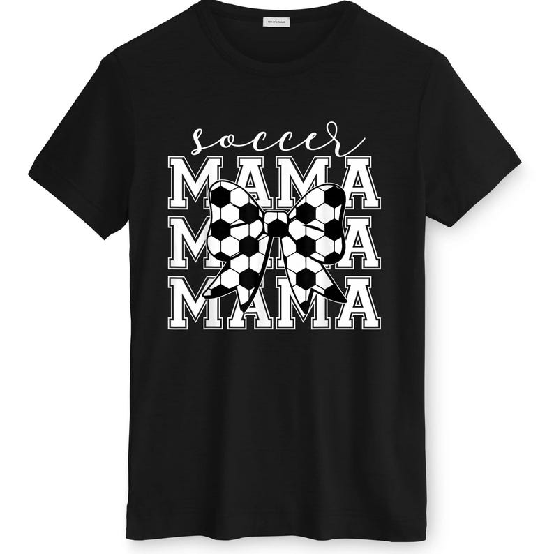 May include: Black t-shirt with the text "soccer MAMA" in white. The word "soccer" is in cursive, and "MAMA" is stacked three times with a soccer ball bow in the center. The shirt is made of a soft material.