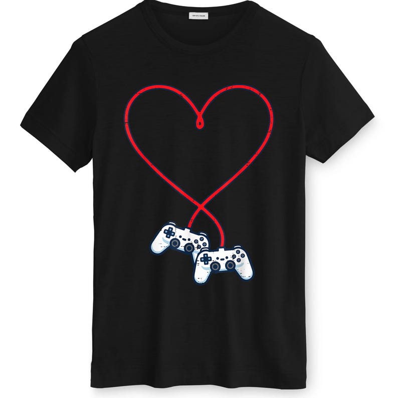 May include: Black t-shirt featuring a red heart design with two white game controllers at the bottom. The controllers are connected to the heart by a red line, creating a unique graphic.